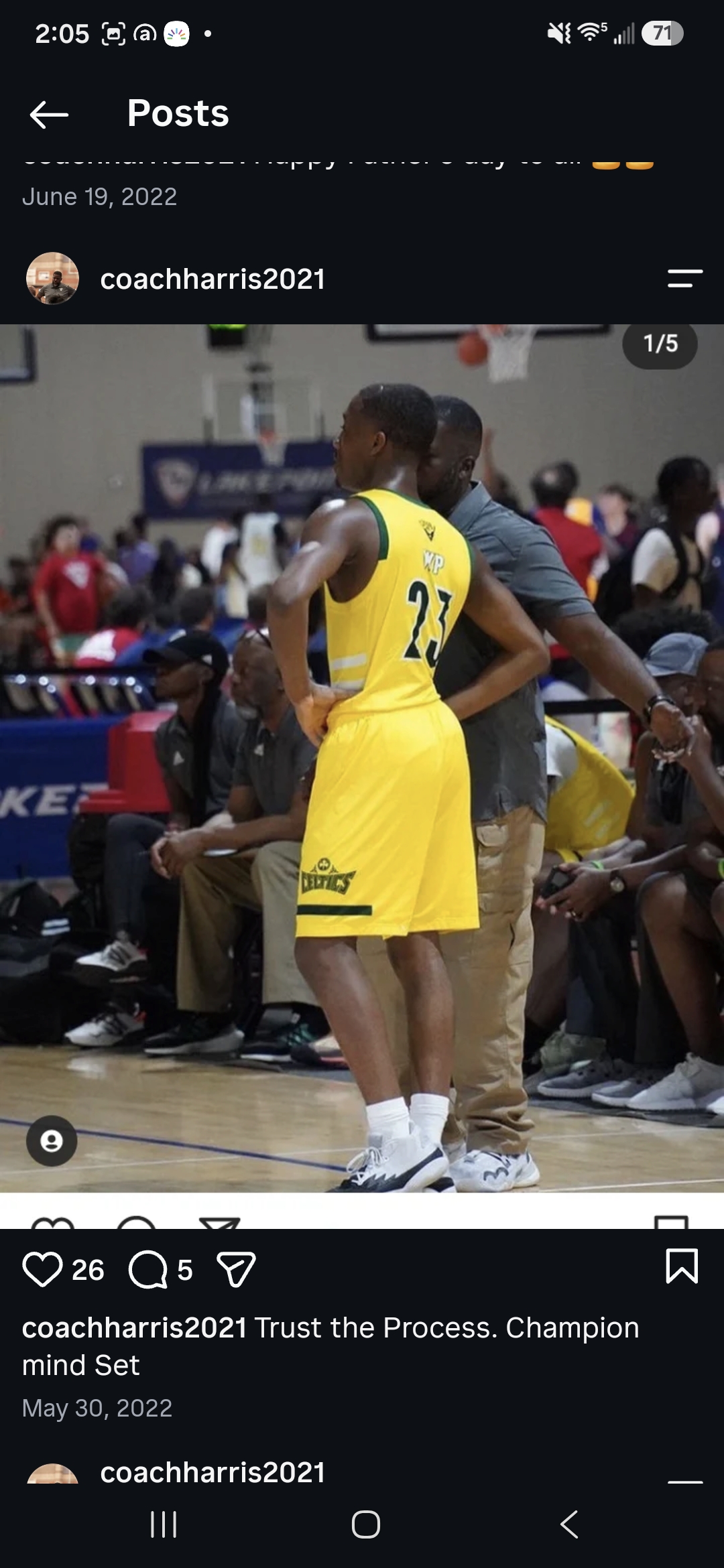 Coach Harris coaching from the sideline during a youth basketball game